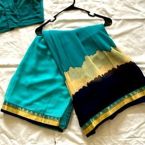 Teal, cream, dark navy . Formal Indian/Pakistan wear.